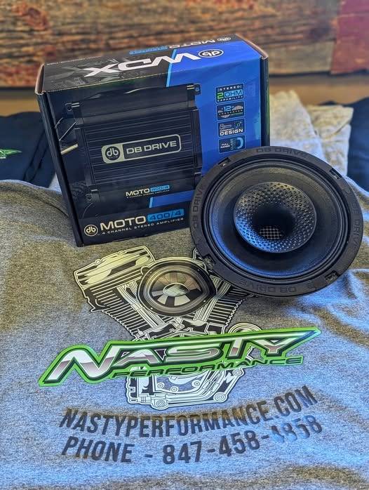 futuristic audio design, inspired, sketching a blueprint, photorealistic, cozy office with design sketches scattered, highly detailed, holographic display, microscopic clarity, vibrant colors, ceiling spotlight, shot with an 85mm lens.