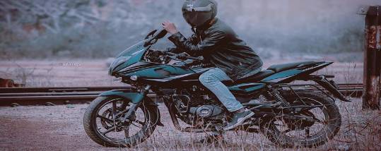 industrial storage unit, imposing and robust, dwarfs surrounding structures, photorealistic, in a sprawling urban landscape with skyscrapers, highly detailed, steel framework reflecting the city lights, cold grey tones, high-contrast city lights, shot with a 24mm lens