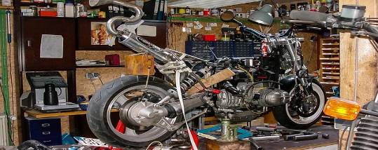 festive seasonal storage, cheerful and vibrant, packed tightly, photorealistic, inside a garage cluttered with outdoor equipment, highly detailed, colorful wrapping paper and glitter, smooth plastic surfaces, bright festive hues, overhead fluorescent lighting, shot with a 28mm lens