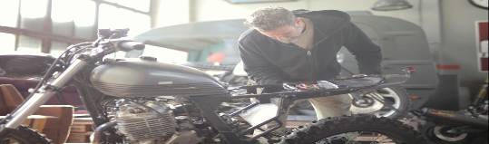 spooky storage bin, mysterious and eerie, left forgotten, photorealistic, in a dimly lit basement with flickering lights, highly detailed, shadows dance across the floor, aged and rusty metal, cool monochromatic colors, low-key lighting, shot with a 50mm lens