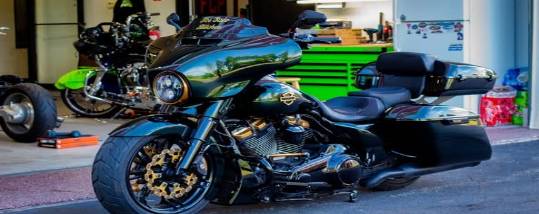 precision performance gear, focused determination, assembling components, photorealistic, cluttered workbench surrounded by mechanical parts, highly detailed, moving machinery, full-frame, deep red, soft spotlight, shot with a macro lens