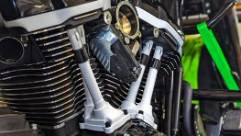 robust performance gear, relaxed poise, arranging tools, photorealistic, bustling workshop with lively discussions, highly detailed, tools clinking, cinematic quality, matte black, luminous lighting, shot with a prime lens