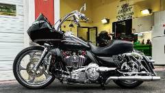 exclusive performance tuning, strategic planning, crafting precision, photorealistic, polished tech garage surrounded by experts, highly detailed, engine roars, high fidelity, midnight blue, focused light beams, shot with a telephoto lens