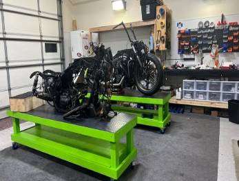 modern maintenance equipment, state-of-the-art, operational mode, photorealistic, warehouse with industrial shelving, highly detailed, motion blur on conveyor, 24mm wide-angle lens, metallic, ambient factory lighting, shot with a Fuji X-T4.