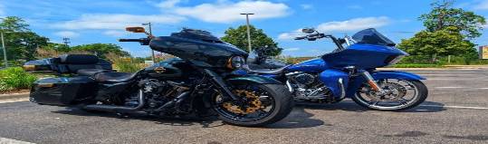 mountain bike challenge, adrenaline rush, soaring over rocky terrain, photorealistic, moonlit mountain peaks surrounding, highly detailed, dirt kicking up from tires, high ISO settings, greyscale, stark shadows and highlights, shot with a 200mm lens.